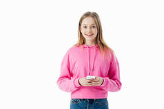 快乐的少女在粉红色连帽衫举行智能手机隔离在白色