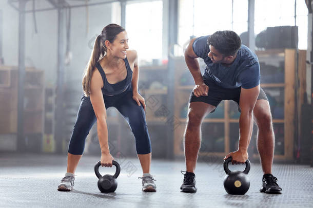 Strong, wellness couple doing kettlebell weight exercise, workout or training inside a gym. Happy sp