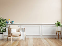 乳白色的房间墙壁，以温暖的色调模仿，扶手椅和装饰最少。