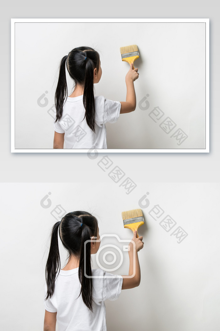 双马尾女孩拿着刷子工具粉刷墙壁