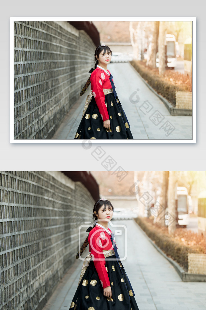 身穿红色韩服的少女站在围墙边图片图片