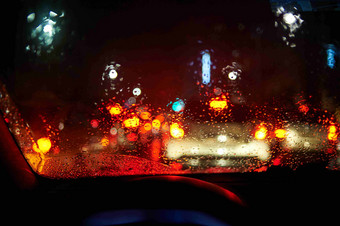 雨夜交通车窗外灯光场景摄影图