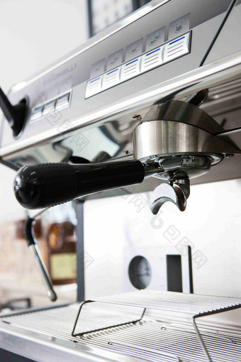 咖啡机不锈钢压粉器细节摄影图