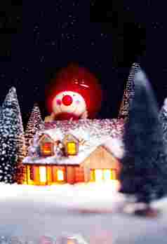 圣诞节雪人雪花木屋暖灯摄影图