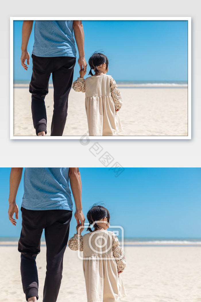 夏天沙滩父亲牵着孩子走路图片