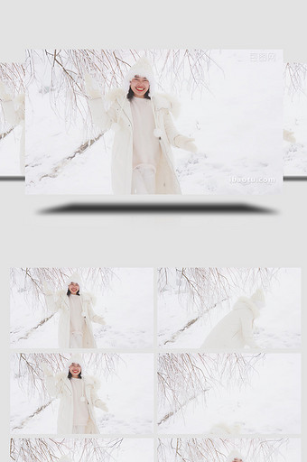 人物形象女孩雪地里打雪仗4K实拍图片