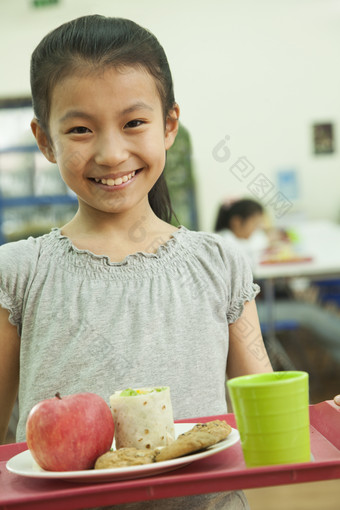 小女孩学生微笑吃饭食堂<strong>苹果水果</strong>微笑摄影图