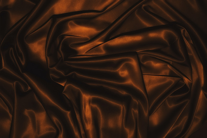 棕色丝绸褶皱纹理背景
