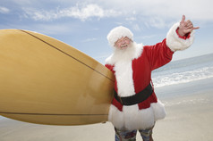 清新冲浪的圣诞老人摄影图