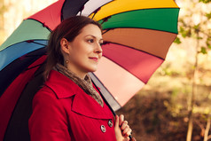深色调打花伞的女人摄影图