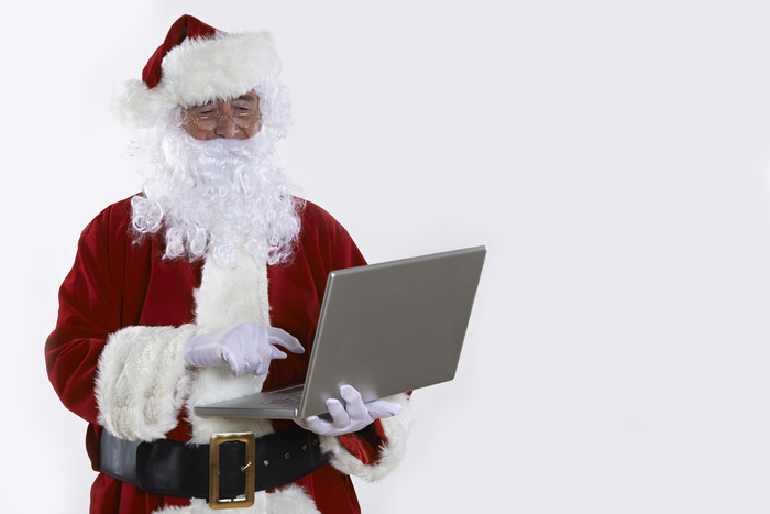 圣诞老人手中的笔记本电脑