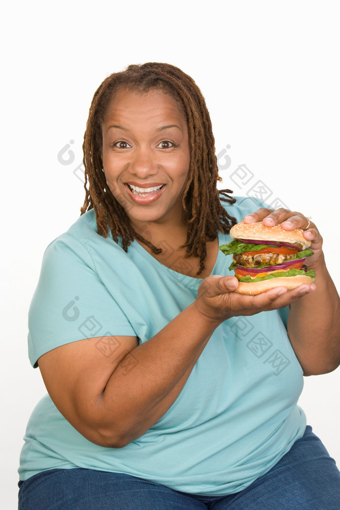 简约吃汉堡的胖女人摄影图