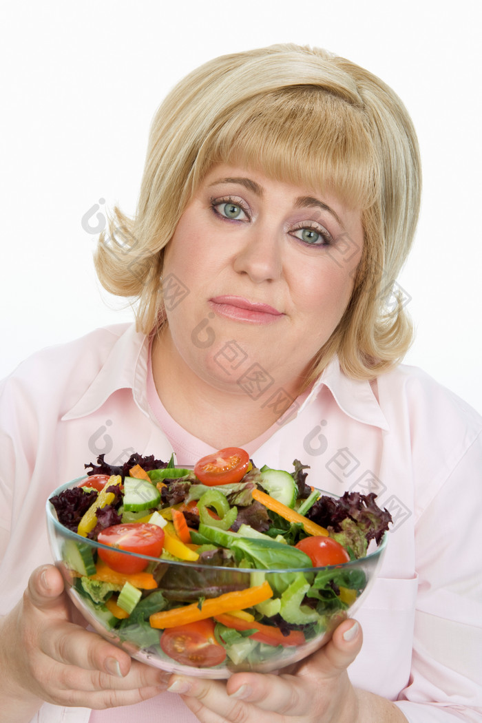 简约吃青菜的女人摄影图