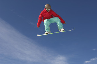 蓝色调腾空滑雪的人摄影图
