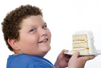 简约拿蛋糕的胖孩摄影图