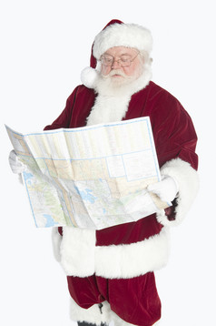 看地图的圣诞老人摄影图