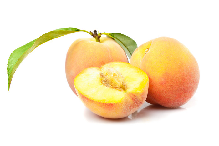 黄桃桃子食物摄影图