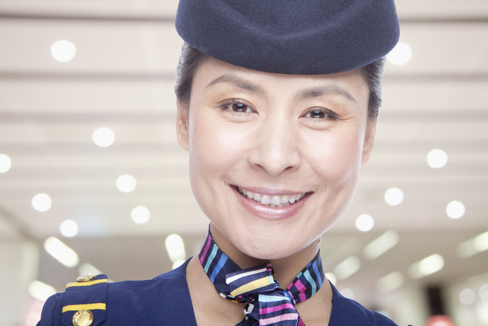 成熟的空姐机场制服女人微笑职业工作摄影