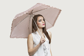 打遮阳伞的女人摄影图