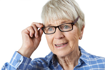 简约风戴眼镜的老妇人摄影图