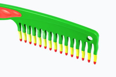 绿色梳头发梳子摄影图