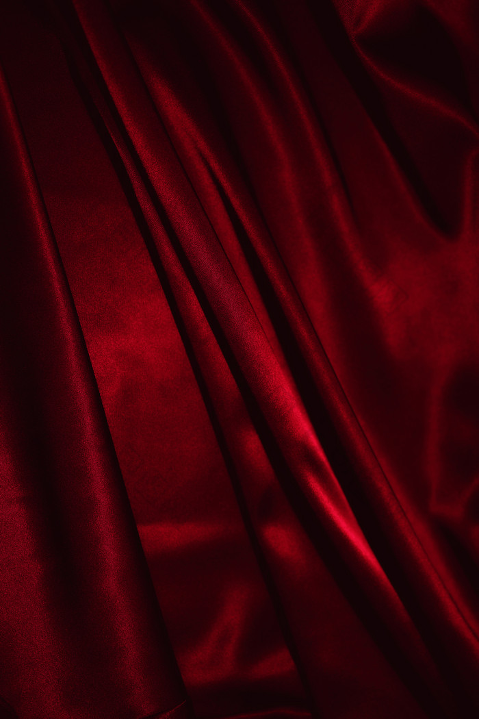 红色丝绸褶皱纹理背景