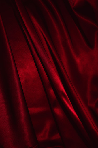红色丝绸褶皱纹理背景
