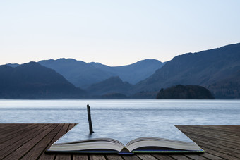 书本湖水山岳摄影图