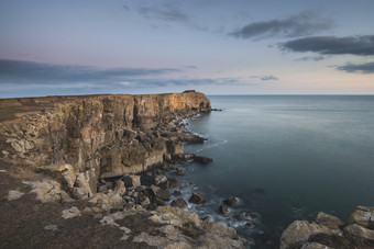 海边的悬崖石头摄影图