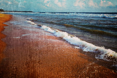 海边沙滩浪花局部摄影图