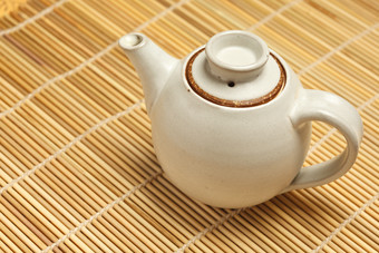 中式竹席茶壶摄影图片