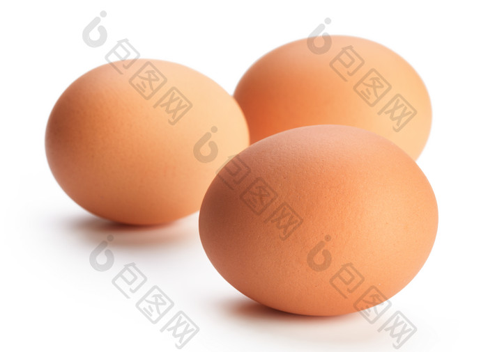 三颗椭圆的鸡蛋摄影图