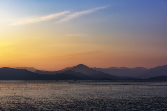 黄昏晚霞海边滩涂地摄影图