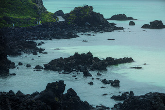 海岸浪拍礁石碎石摄影图