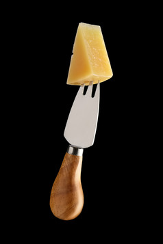 叉子插着的奶酪摄影图
