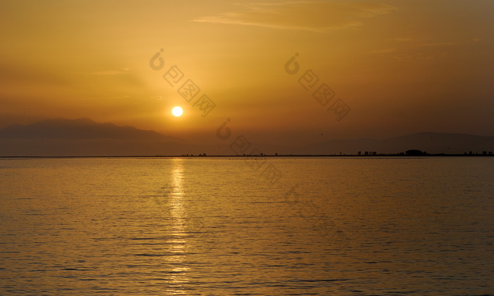 夕阳海水景色摄影图