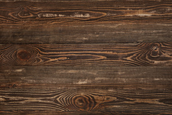 一块深色的黑木材木板