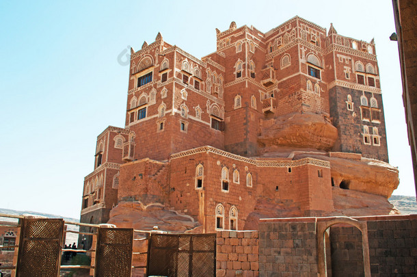 Yemen, Middle East: view of Dar al-Hajar (Stone House), the famous Rock Palace in Wadi Dhahr valley,