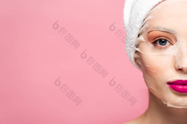 cropped view of young woman in face mask isolated on pink 