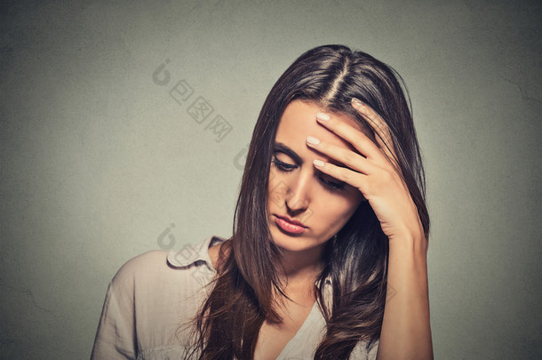 portrait stressed sad young woman looking down 