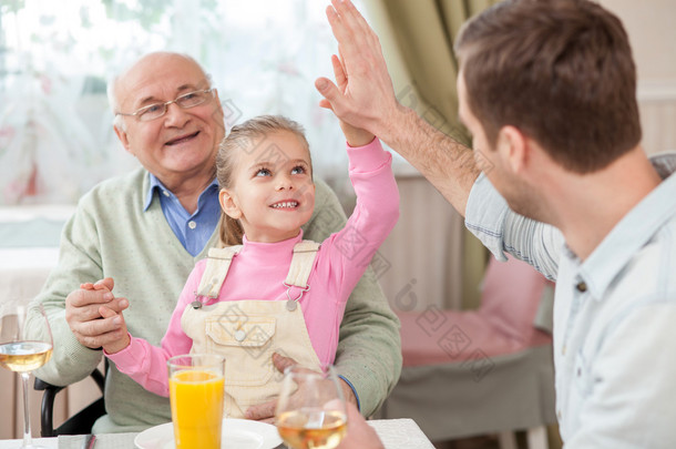 Cute family has a dinner in cafe