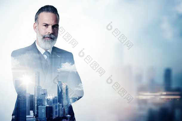 Portrait of bearded businessman in suit and double exposure city on the background. Horizontal