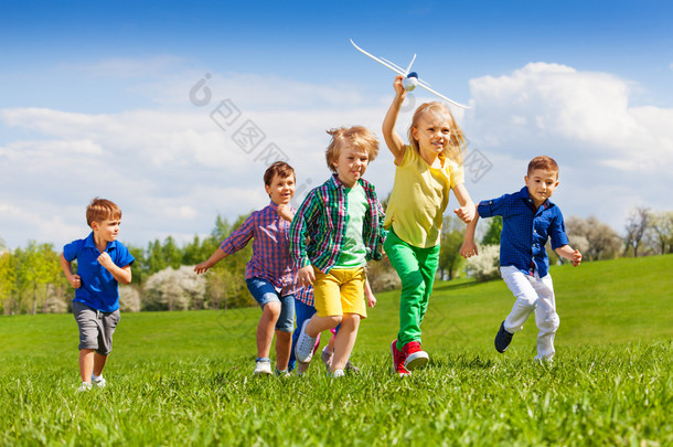 happy running kids with airplane toy