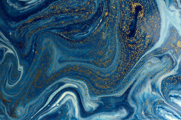 蓝色和金色的背景。液态大理石图案