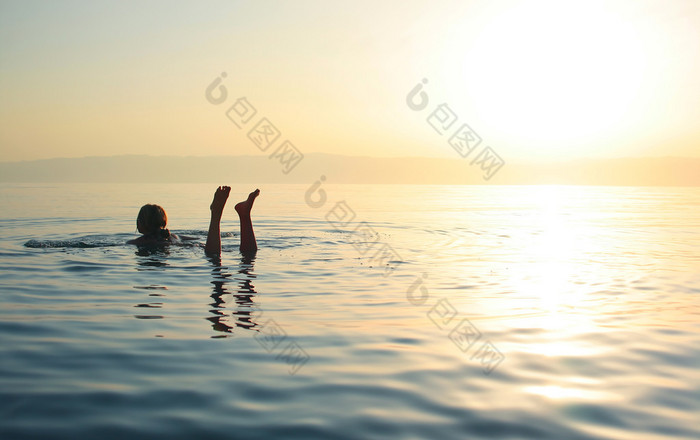 Woman swimming in salty water