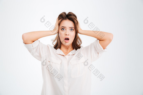 Woman covering ears and shouting