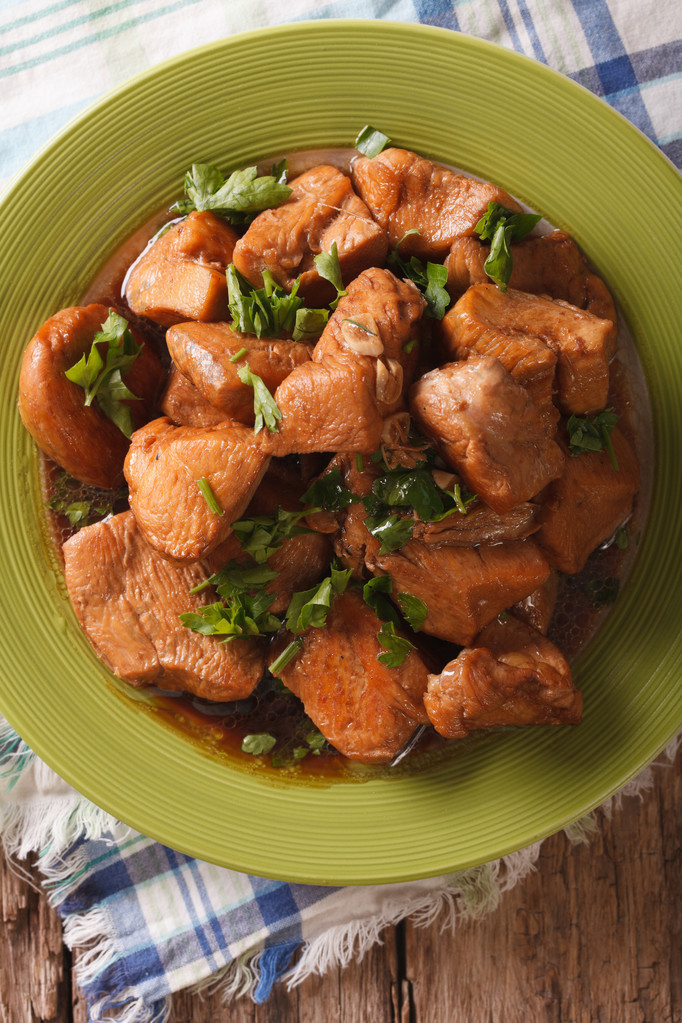 Chicken braised in a sauce Adobo close-up. vertical top view