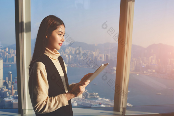 woman reading news on digital tablet