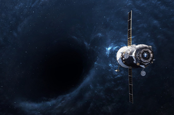 Black hole in space and spacecraft. Elements of this image furnished by NASA