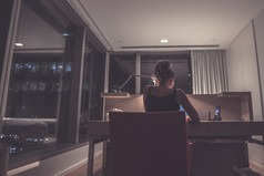 Young woman overworking in the office